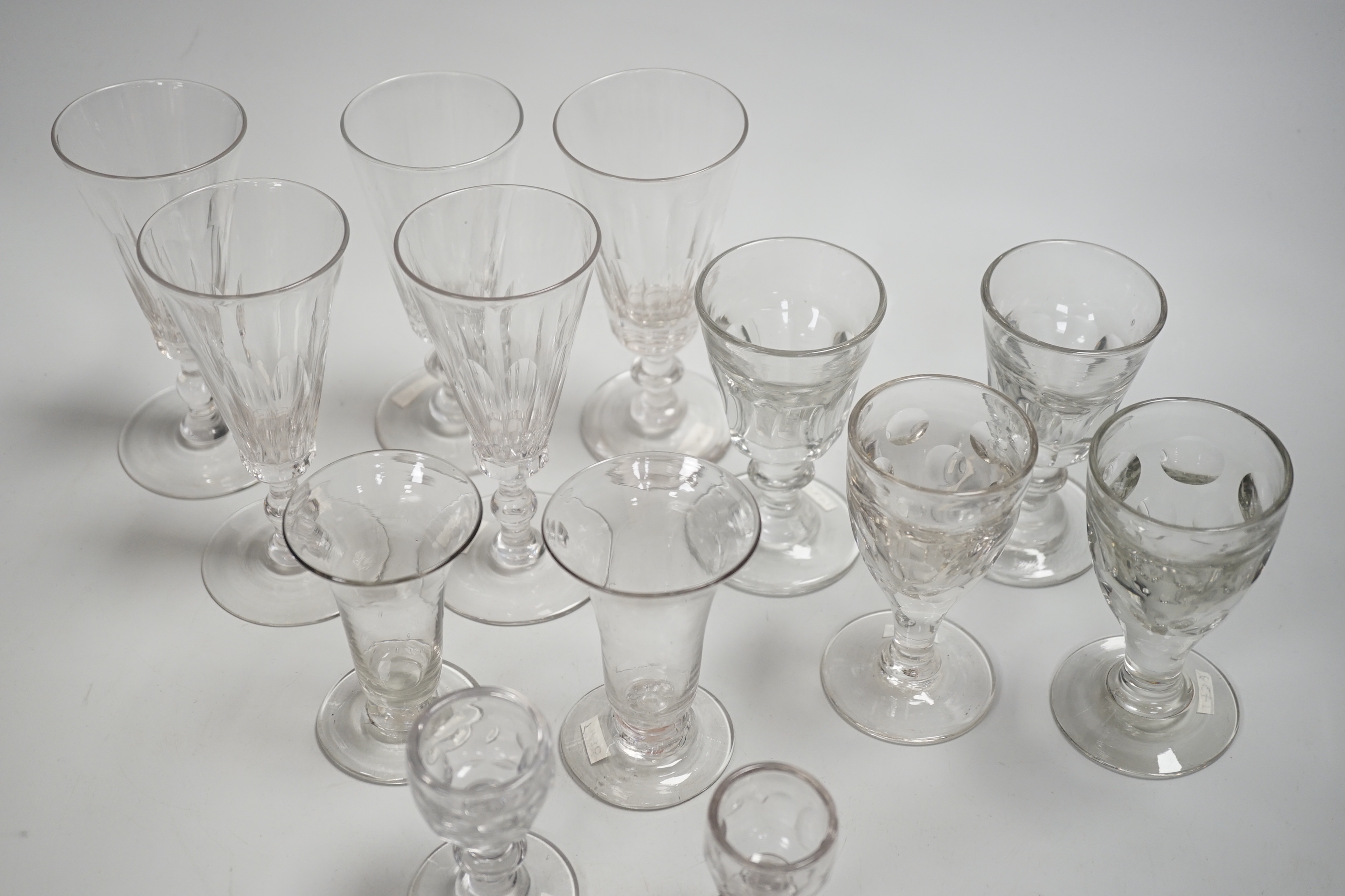 1429, 1430, 1451, 1439 & 1435 A harlequin set of five English lead crystal short ales, c.1820-30, decorated with cut rounded facets, two with blade and three with ball knops, height 14.2cm, together with three pairs of 1